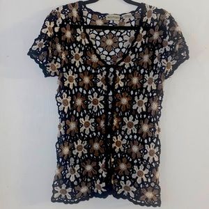 Crocheted cardigan with Daisy design from White Stag.